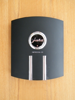 Gebrauchte Frontblende (schwarz/chrom) "Impressa C5" mit Emblem